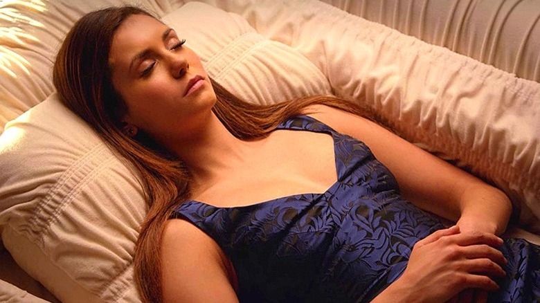 Elena lying in coffin