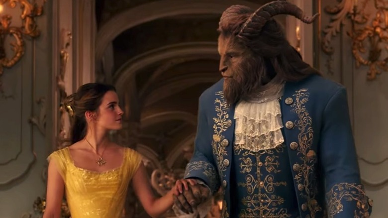 Beauty and the beast hold hands