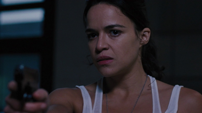 Letty Ortiz aims pistol