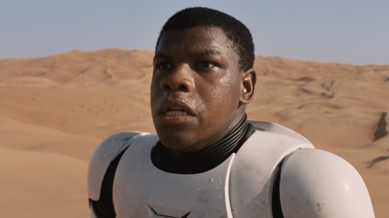 Finn in stormtrooper armor in desert