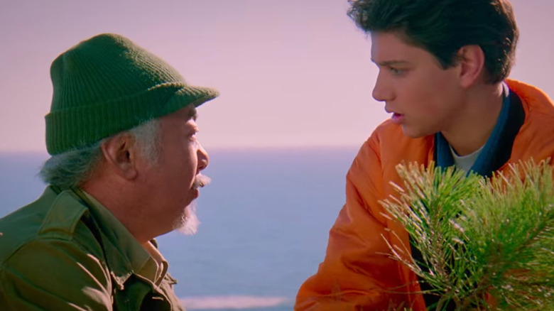 Daniel and Mr. Miyagi with a bonsai tree