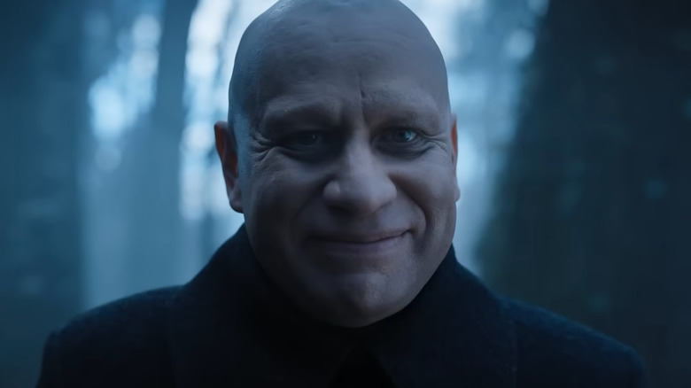 Uncle Fester smiling in the woods