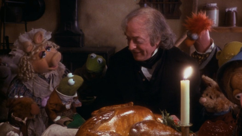 Muppets and Michael Caine eating Christmas dinner together