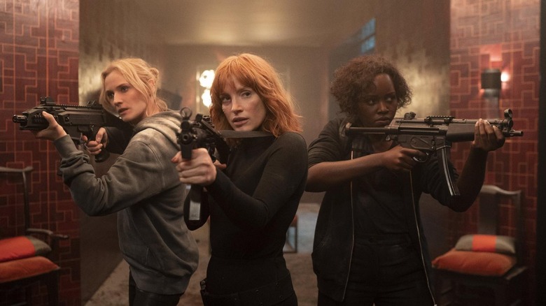 Marie, Mace and Khadijah holding guns