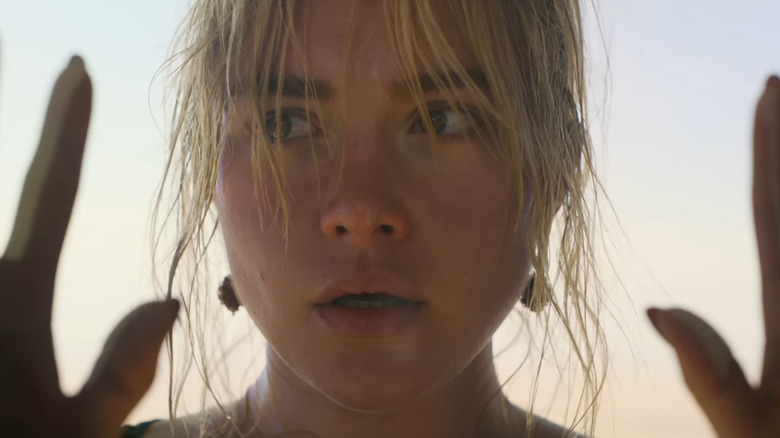 Florence Pugh looking through glass