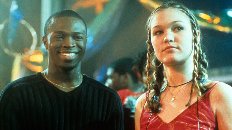 Sean Patrick Thomas and Julia Stiles at party