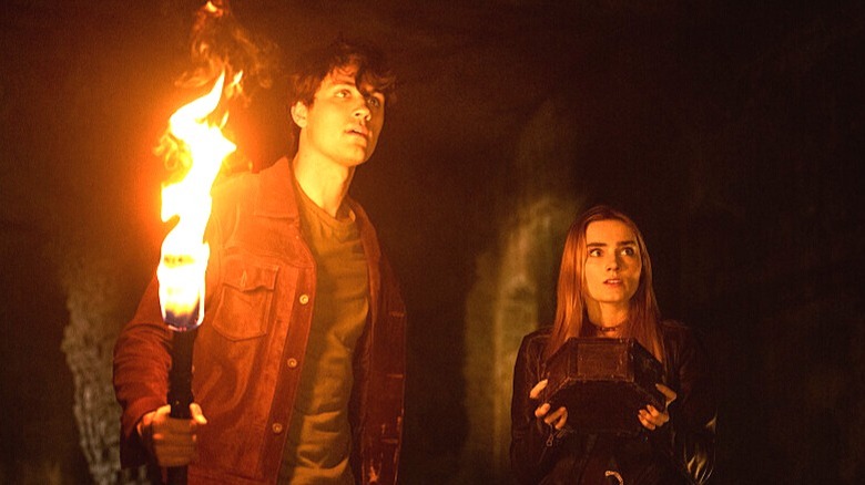 John holding a torch with Mary