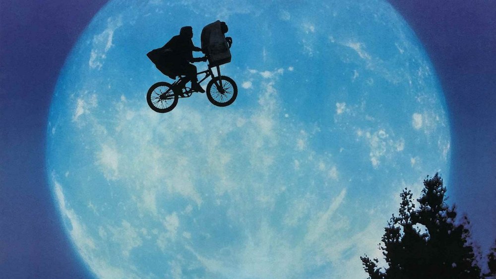 Elliott and E.T. soar through the sky, from E.T.