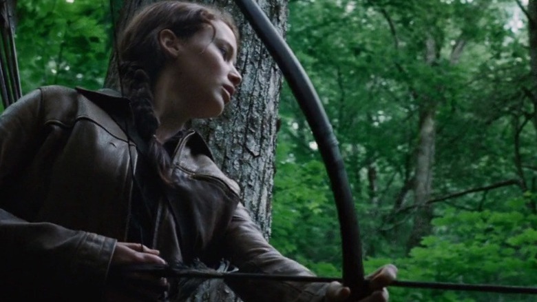 Katniss holding bow and arrow