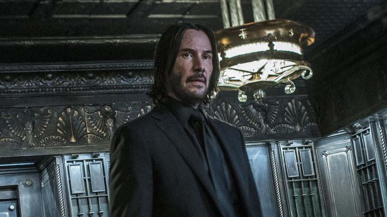 John Wick wearing black suit