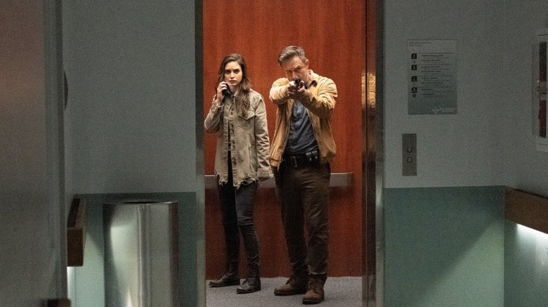 Dewey and Sam exit the elevator