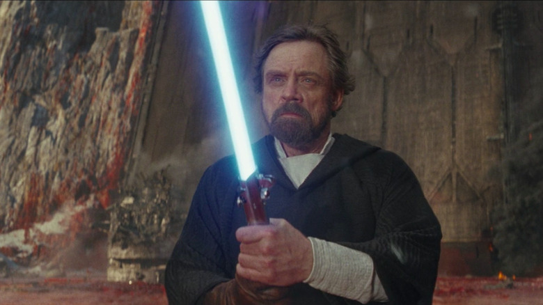 Luke Skywalker projection holding lightsaber