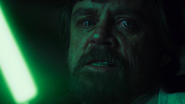 Luke Skywalker holding green lightsaber