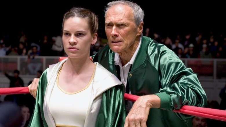 Clint Eastwood giving tips to Hilary Swank