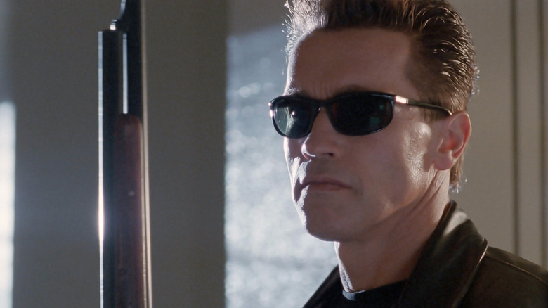 Schwarzenegger in shades with gun