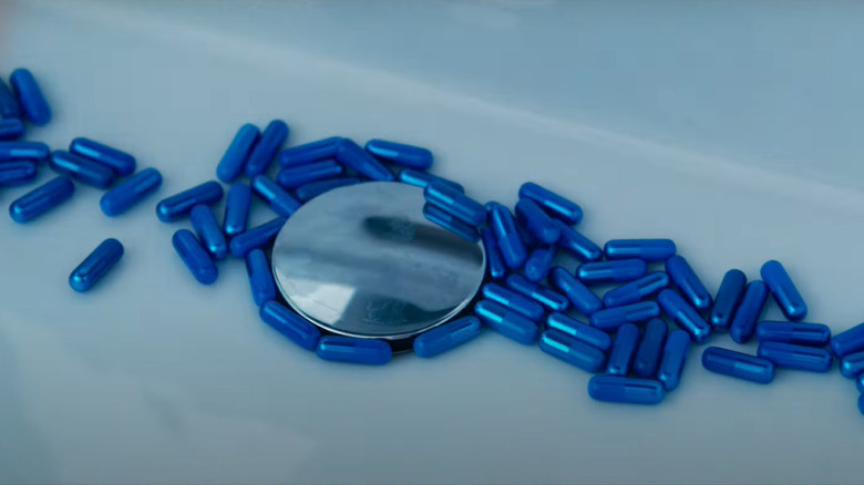 Blue pills in a sink