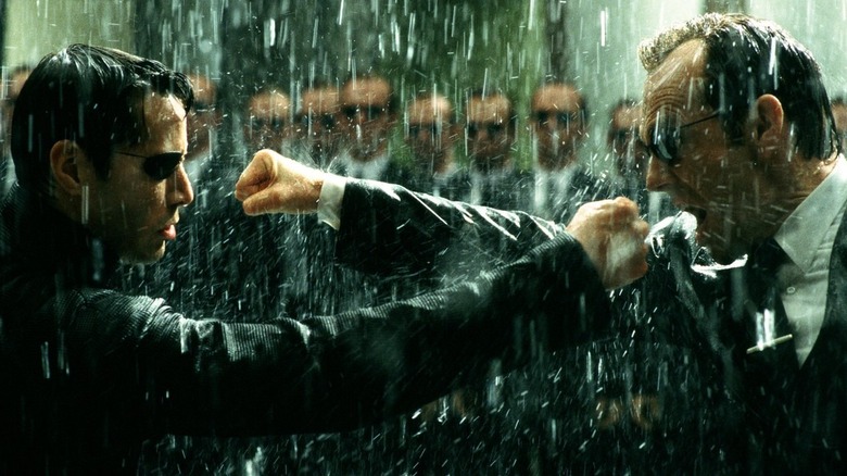 Neo fighting Agent Smith in rain