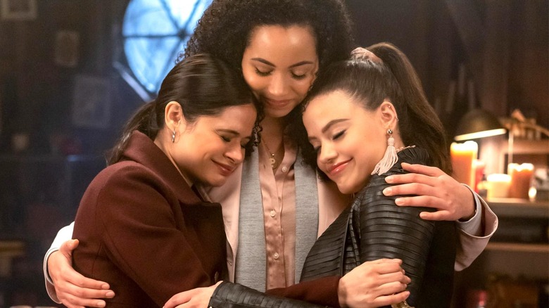 Charmed Macy, Mel, and Maggie smiling and hugging