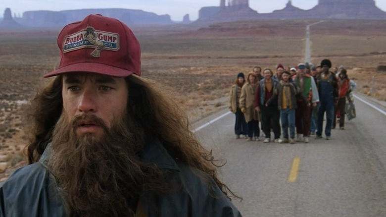 Tom Hanks with beard and hat stops running