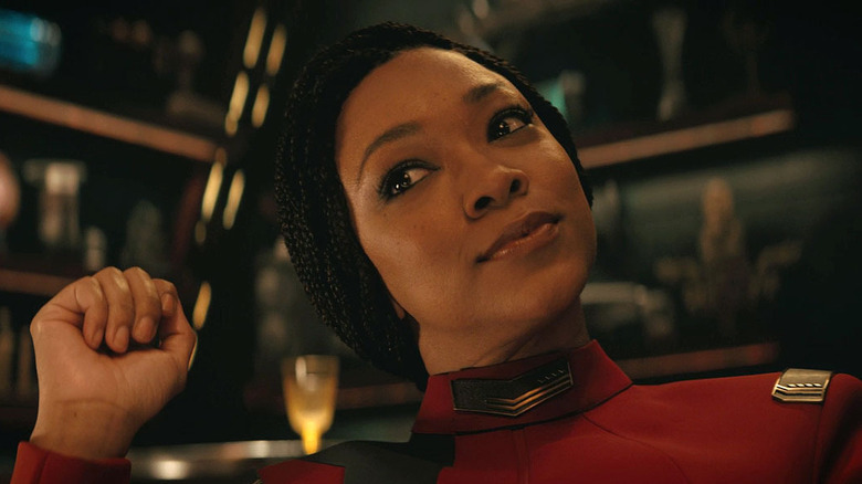 Michael Burnham smirks