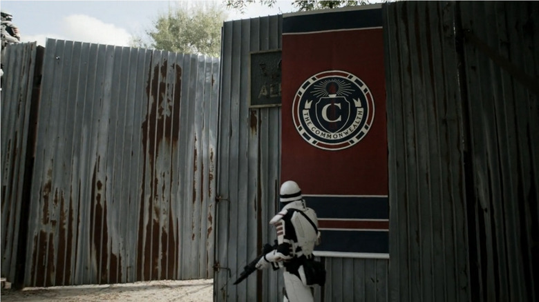 Commonwealth banner at Alexandria border wall