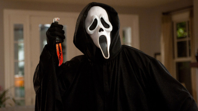 Ghostface wielding a bloody knife