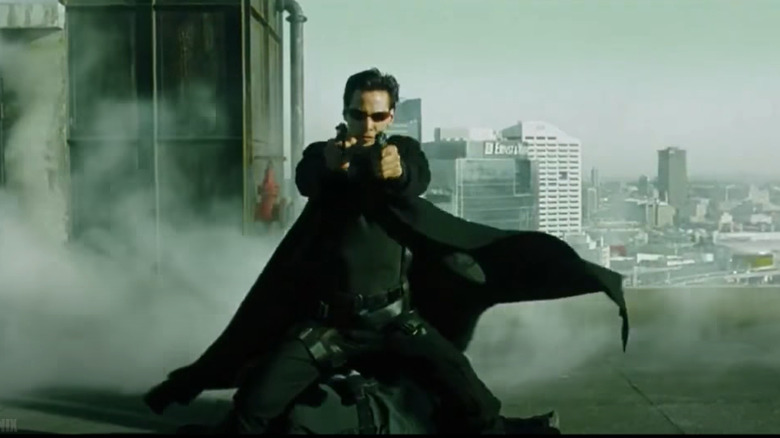 Neo shooting at an Agent in the Matrix