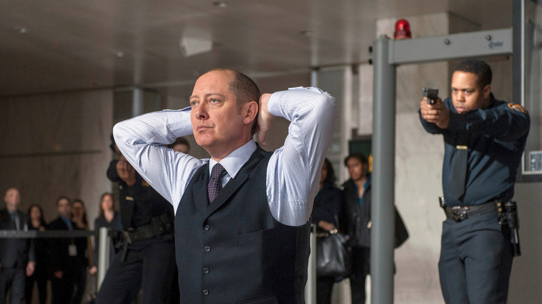 James Spader with his hands up in The Blacklist