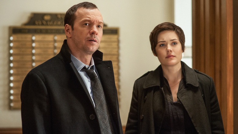 Donnie Wahlberg and Megan Boone investigating 