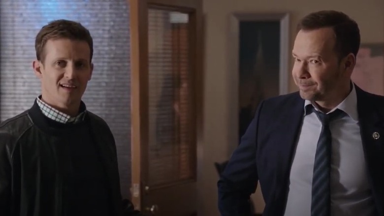 Will Estes and Donnie Wahlberg standing together