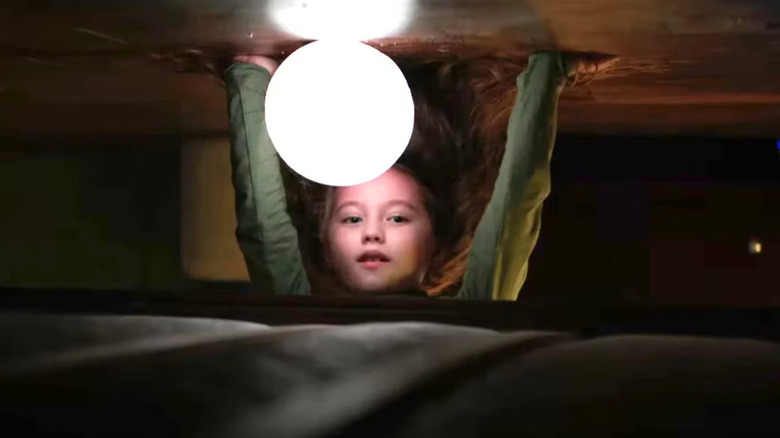 Vivien Lyra Blair and her globe under her bed in "The Boogeyman"