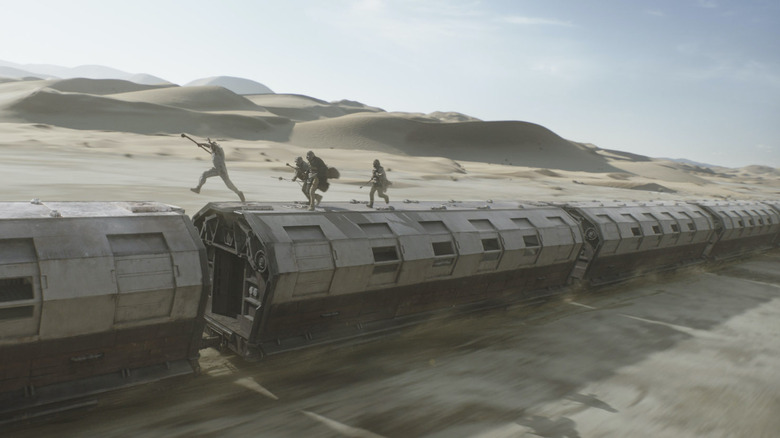 Boba Fett and Tusken Raiders jumping across the top of a train