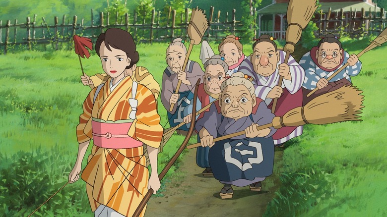 Natsuko leading old ladies holding brooms