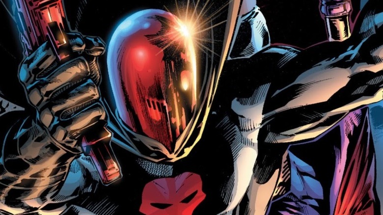 Red Hood holding a gun