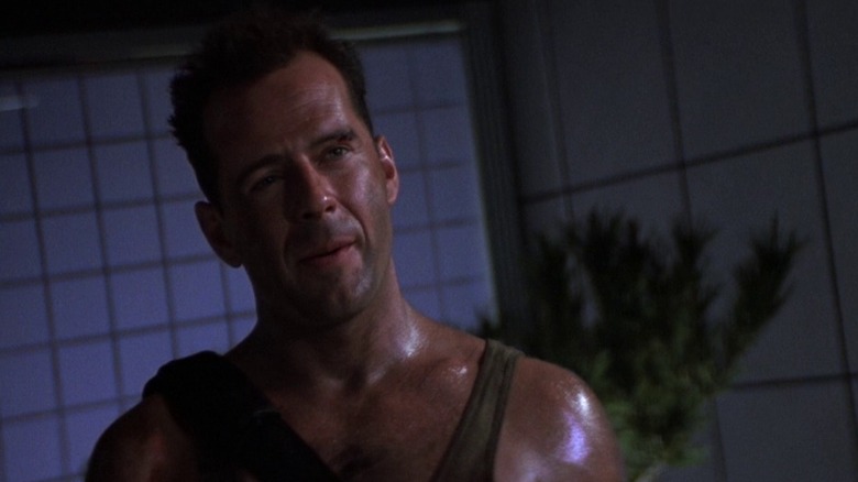 John McClane holding a gun