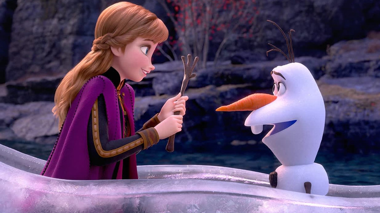 Anna holds Olaf's arms in "Frozen 2" (2019)