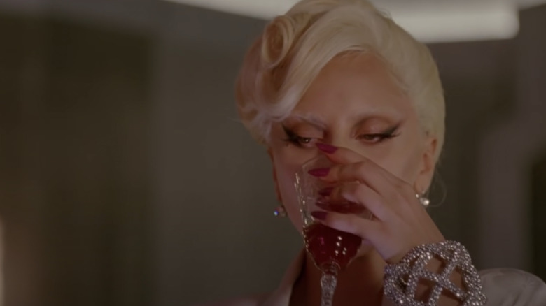 Lady Gaga drinking from glass