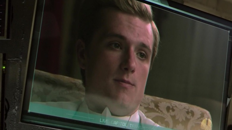 Peeta smiling on a television screen