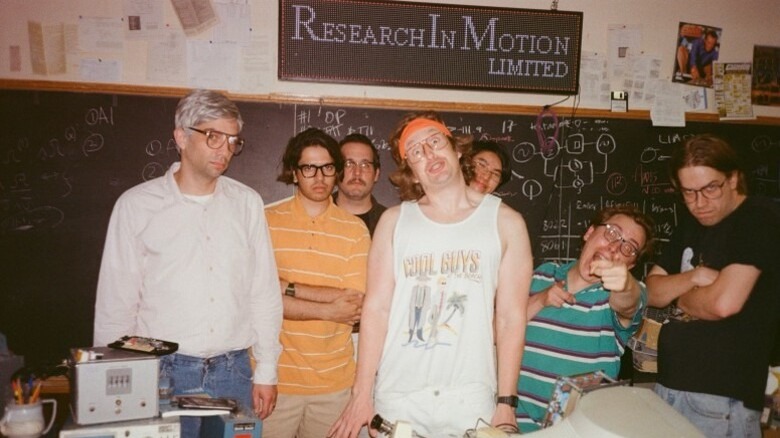 The Research In Motion team posing in front of blackboard