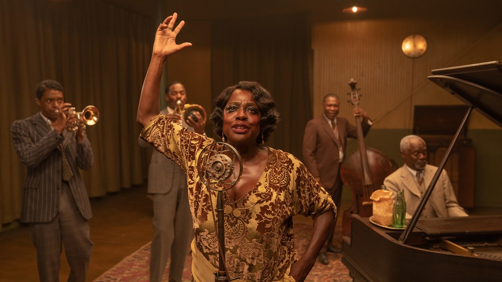 Ma Rainey singing at microphone