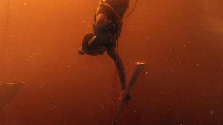 Contestant diving in water