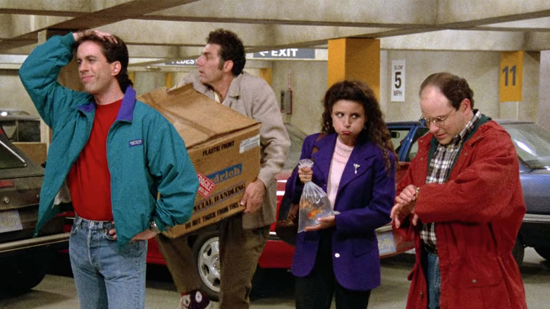 Jerry, Kramer, Elaine, and George in a parking garage