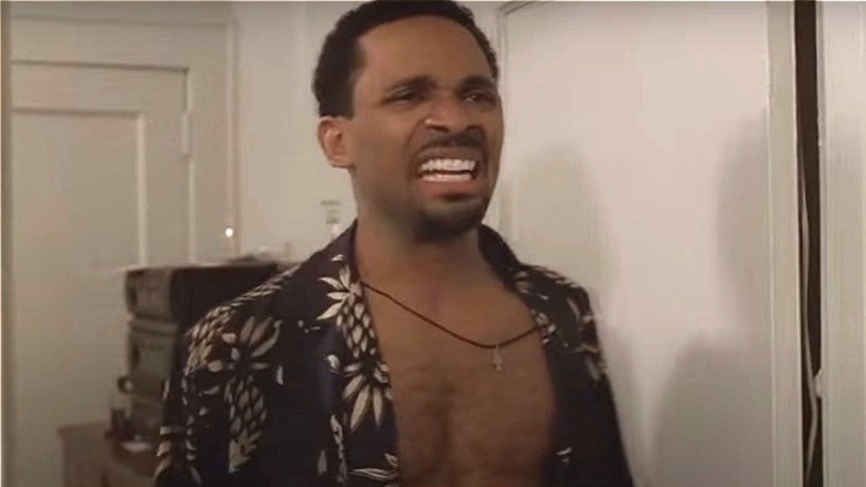 Mike Epps reacting to mobsters in a scene from The Sopranos 