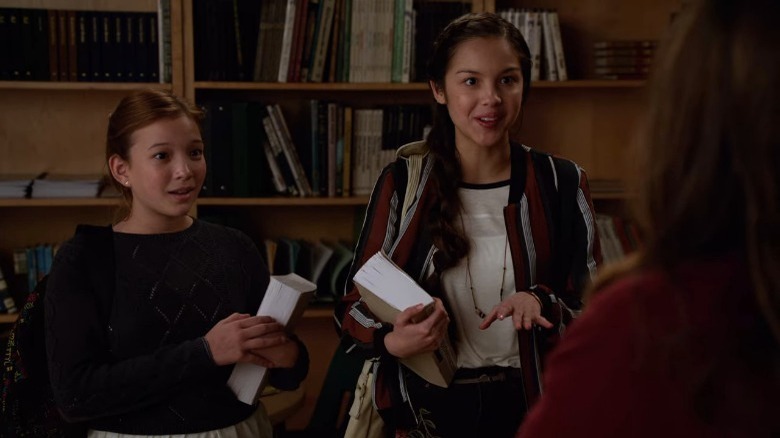 Olivia Rodrigo holding a book