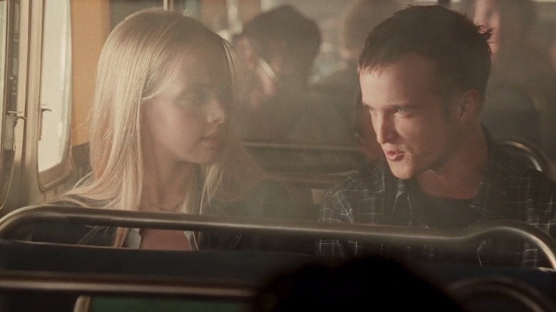 Aaron Paul sits on bus