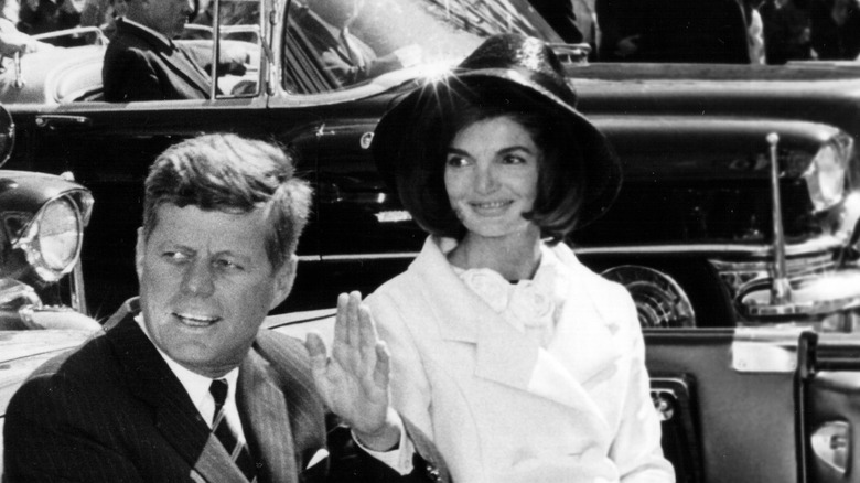 John F. Kennedy waving with Jackie