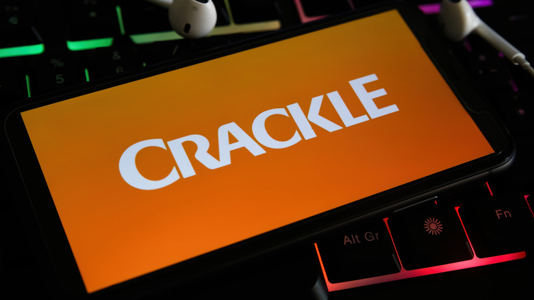 Crackle logo on phone atop keyboard