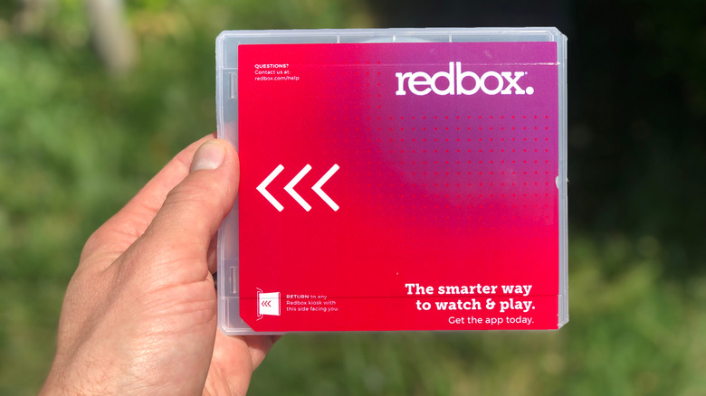 hand holding Redbox case