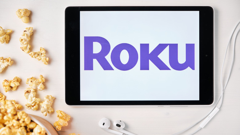 Roku logo on tablet surrounded by popcorn