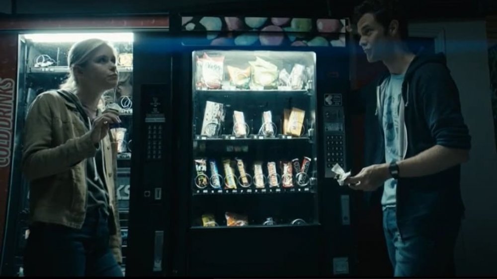 Starlight (Erin Moriarty) eats an Almond Joy with Hughie (Jack Quaid) on The Boys